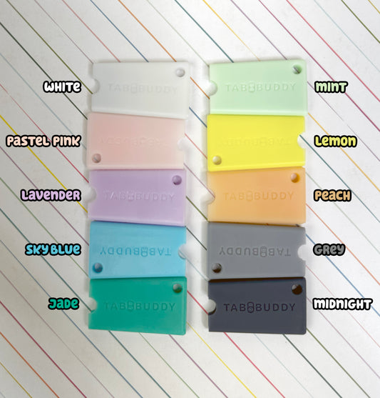 Color swatches of Tab Buddy Minis in various colors on a lined paper background