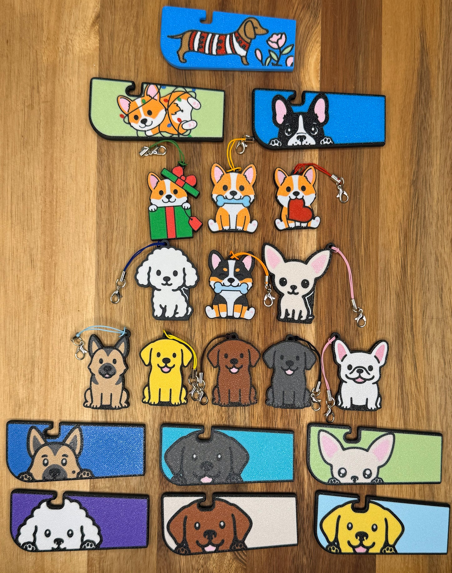 Collection of dog-themed Tab Buddies on a wooden surface