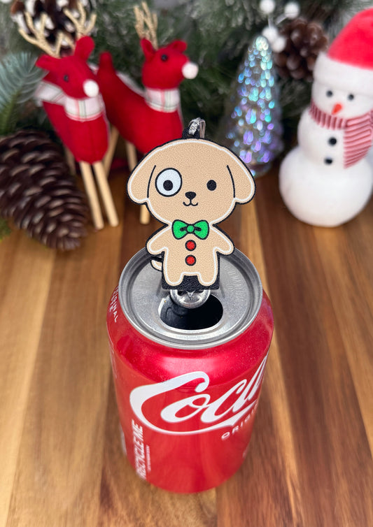 Decorative dog-shaped Tab Buddy on a can with Christmas decorations in the background.