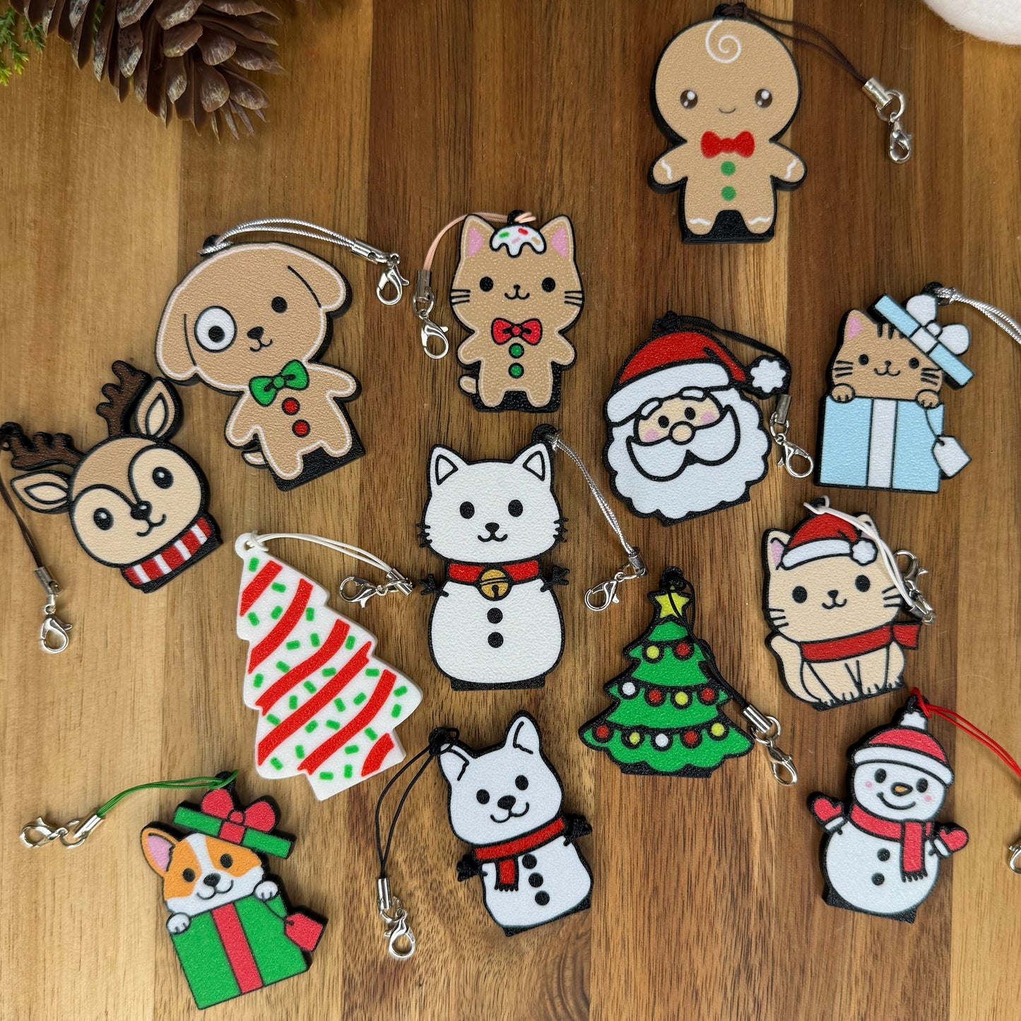 Collection of Christmas-themed Tab Buddies on a wooden surface