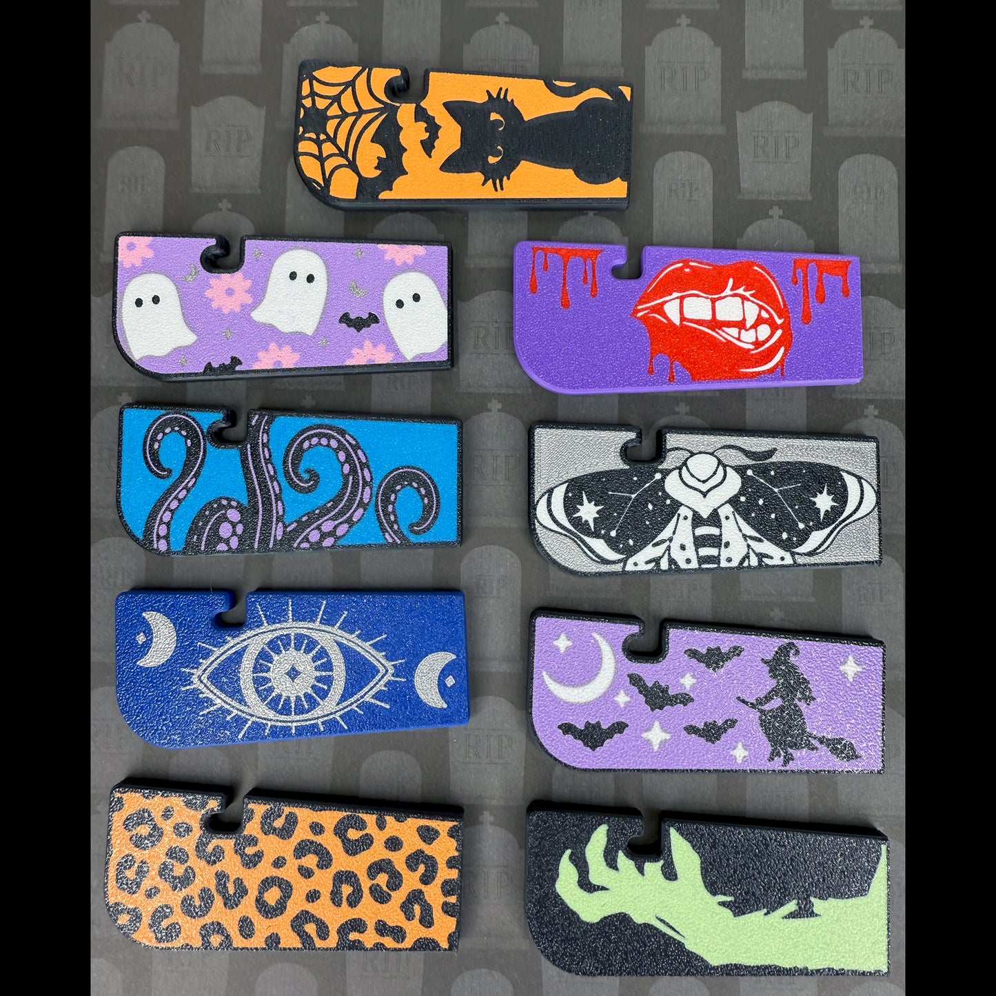 Collection of Halloween-themed Tab Buddy XLs on a matching patterned background