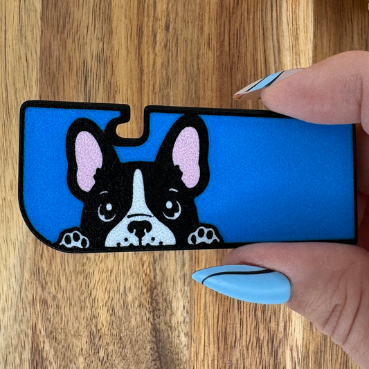 Blue Tab Buddy XL with a dog design held by a hand on a wooden surface