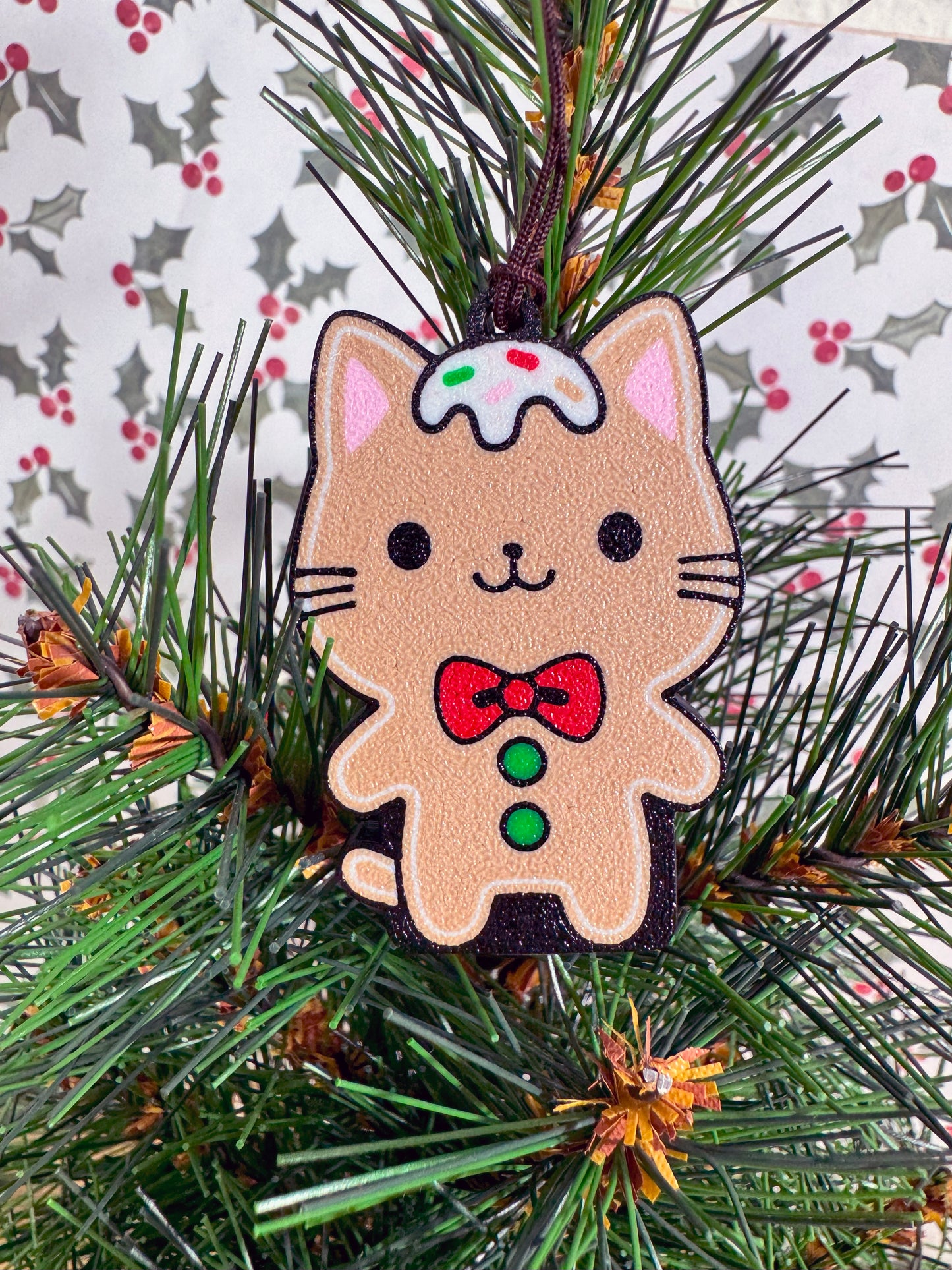 Gingerbread cat Tab Buddy on a Christmas tree with a festive background