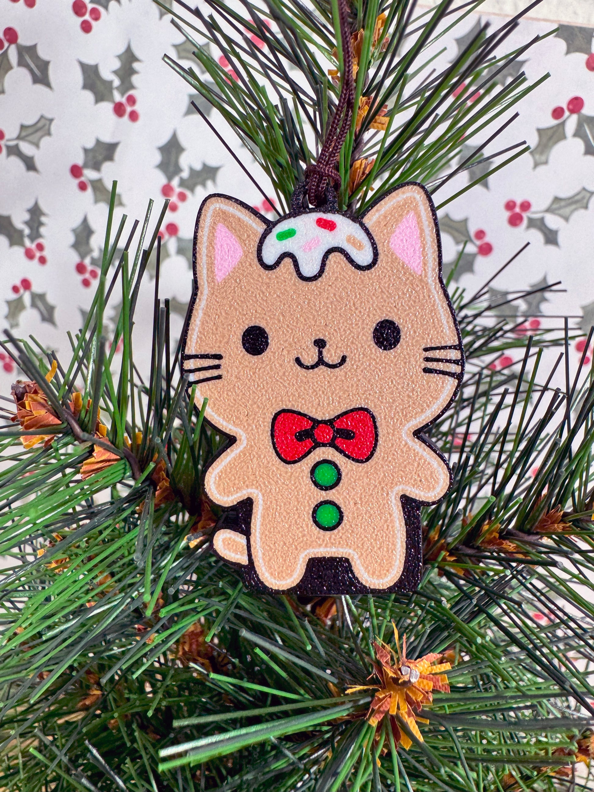 Gingerbread cat Tab Buddy on a Christmas tree with a festive background