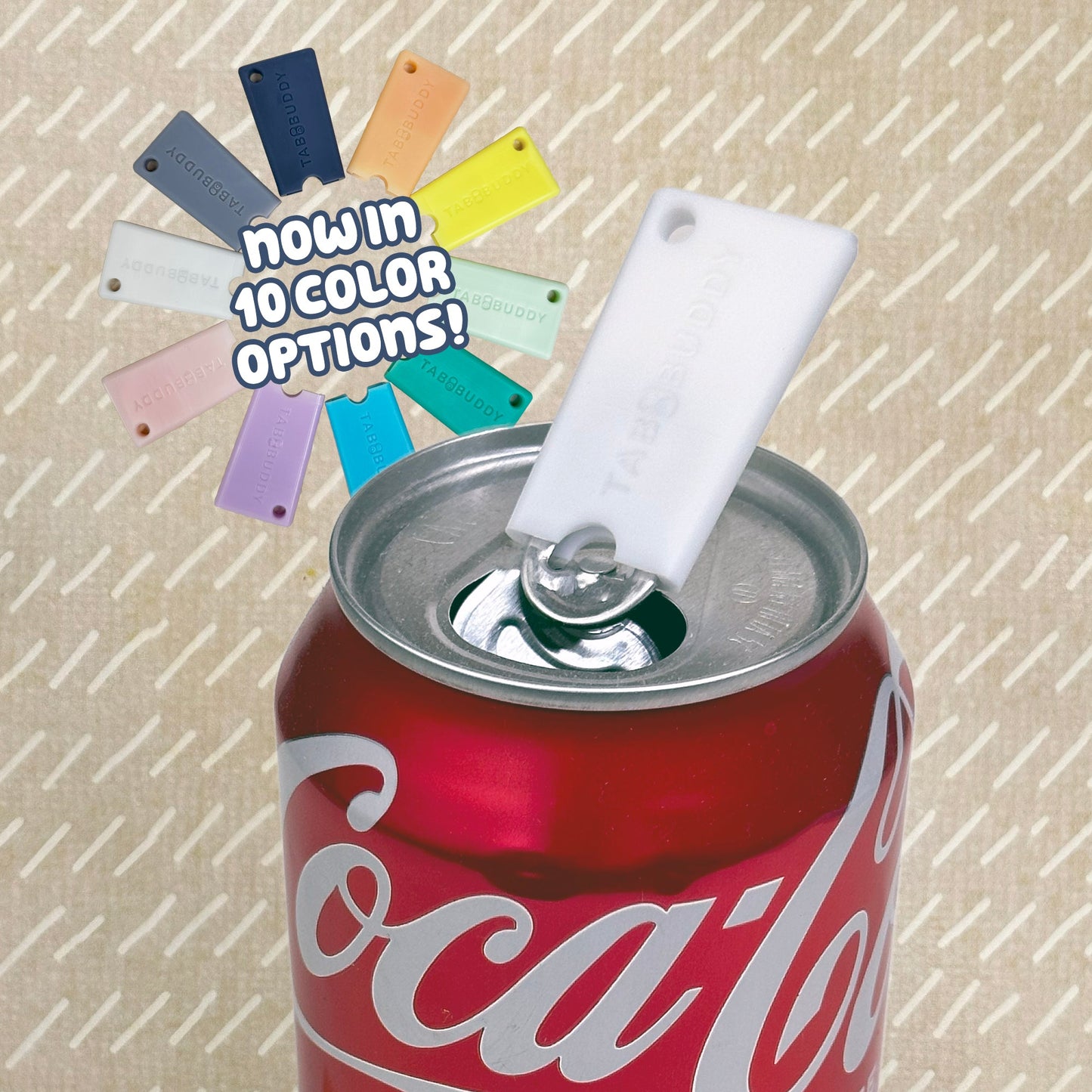 Coca-Cola can with a white Tab Buddy Mini and color swatches on a textured beige background