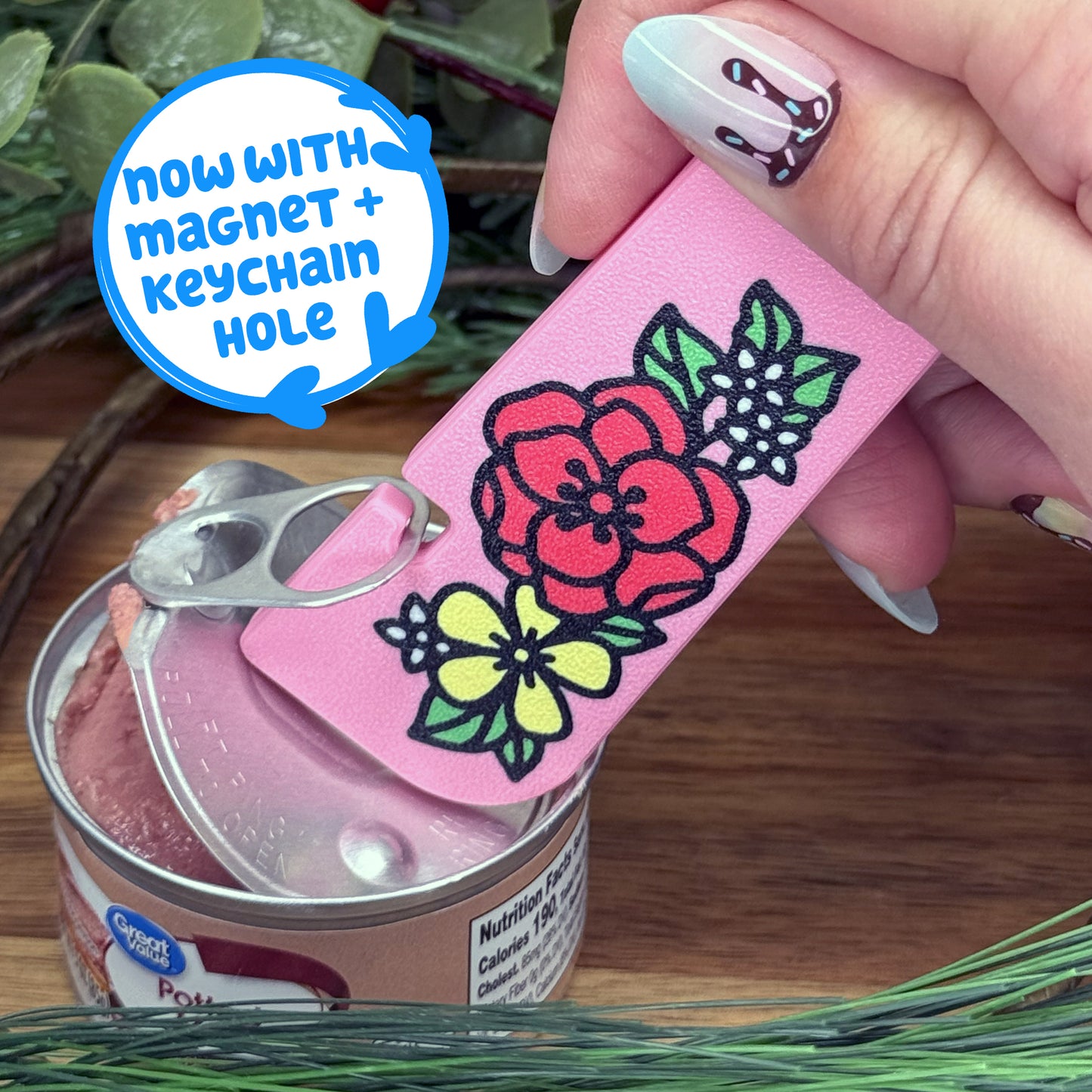 Pink floral Tab Buddy XL with a magnet and keychain opening a can with text that reads 'Now with magnet + keychain hole'.