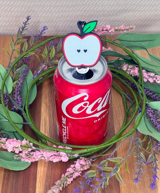 Coca-Cola can with an apple Tab Buddy on a wreath with flowers