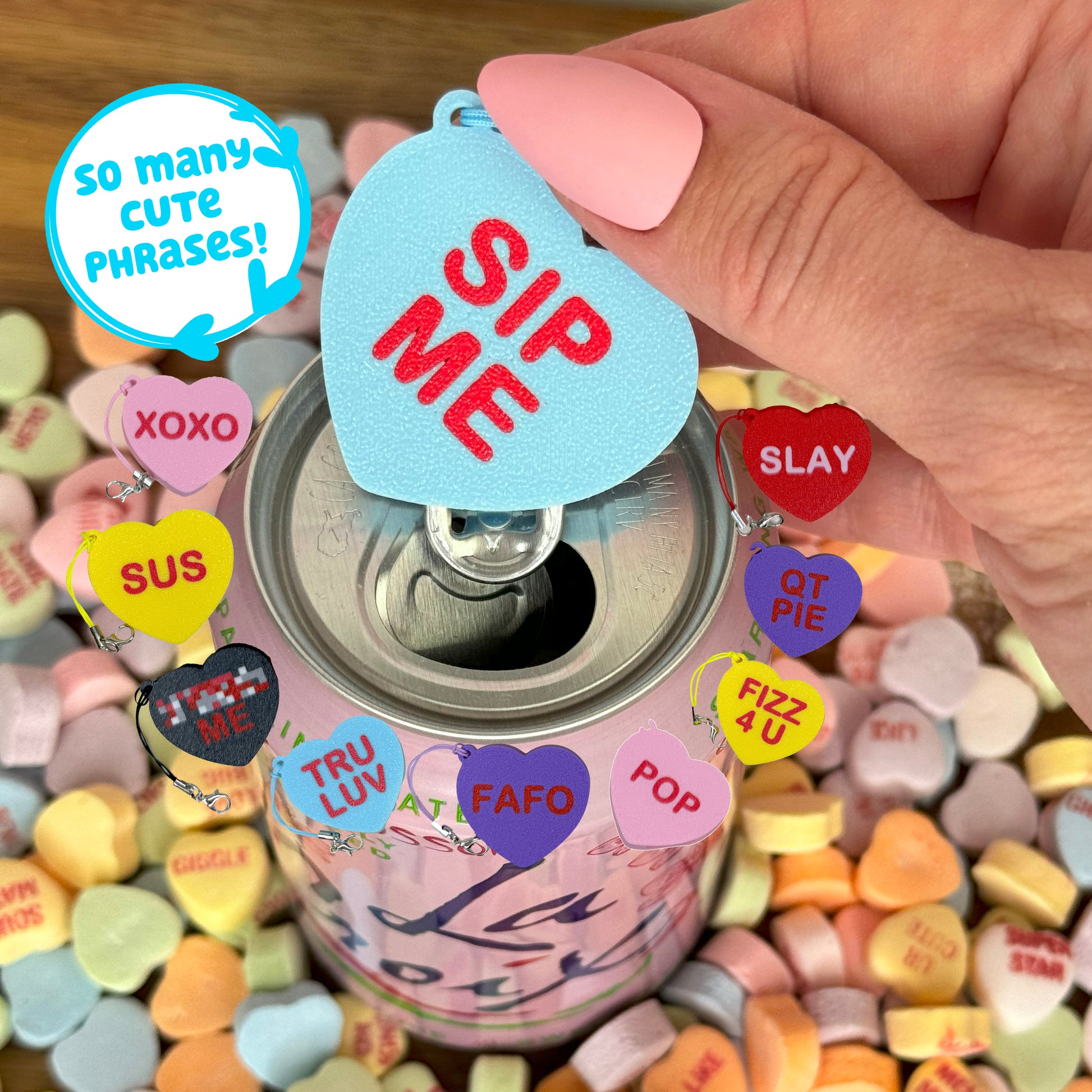 Can with colorful heart-shaped Tab Buddy labeled with phrases, held by a hand. Text indicates "so many cute phrases"