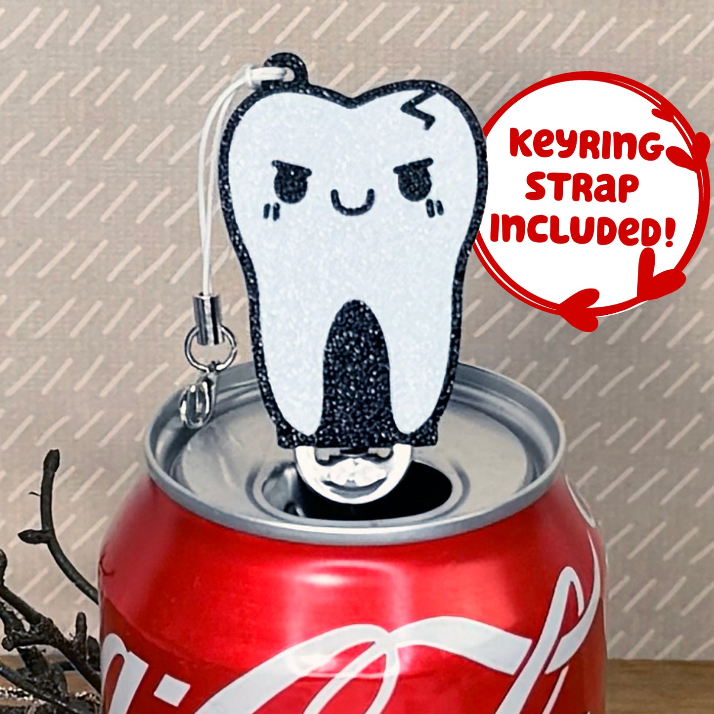 Tab Buddy shaped like a tooth on a soda can with a 'Keyring Strap Included!' label.