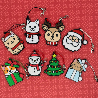 A collection of 8 Christmas-themed soda Tab Buddies rest against a red floral background.