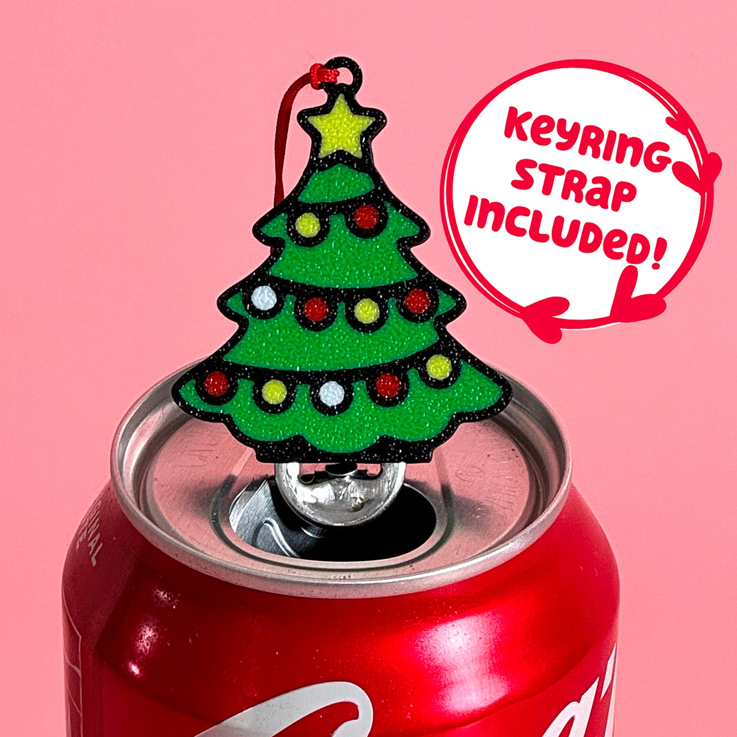 Christmas tree Tab Buddy on a can with a pink background and text 'Keyring strap included!'.