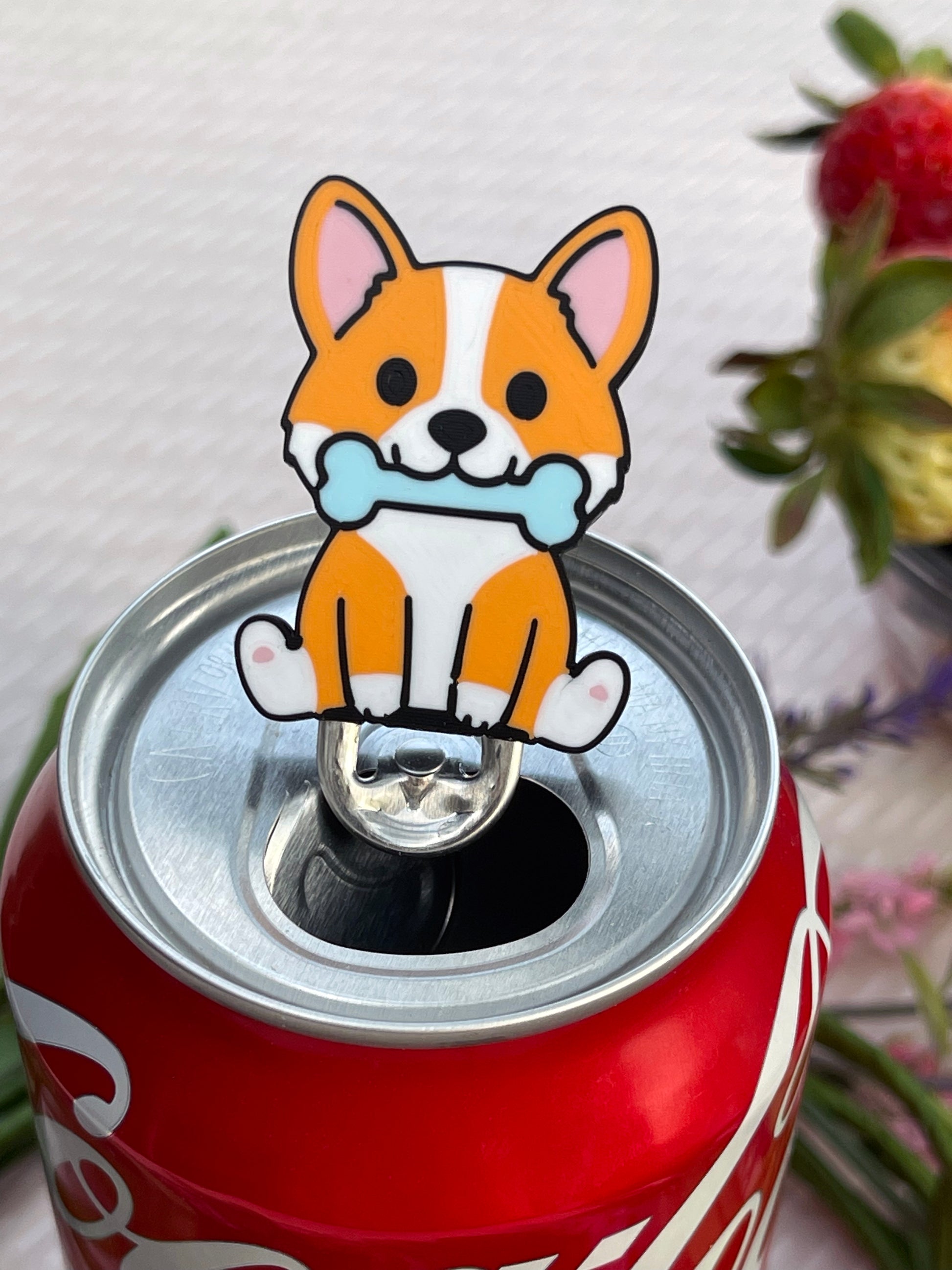 Can with a dog-shaped Tab Buddy on a light background