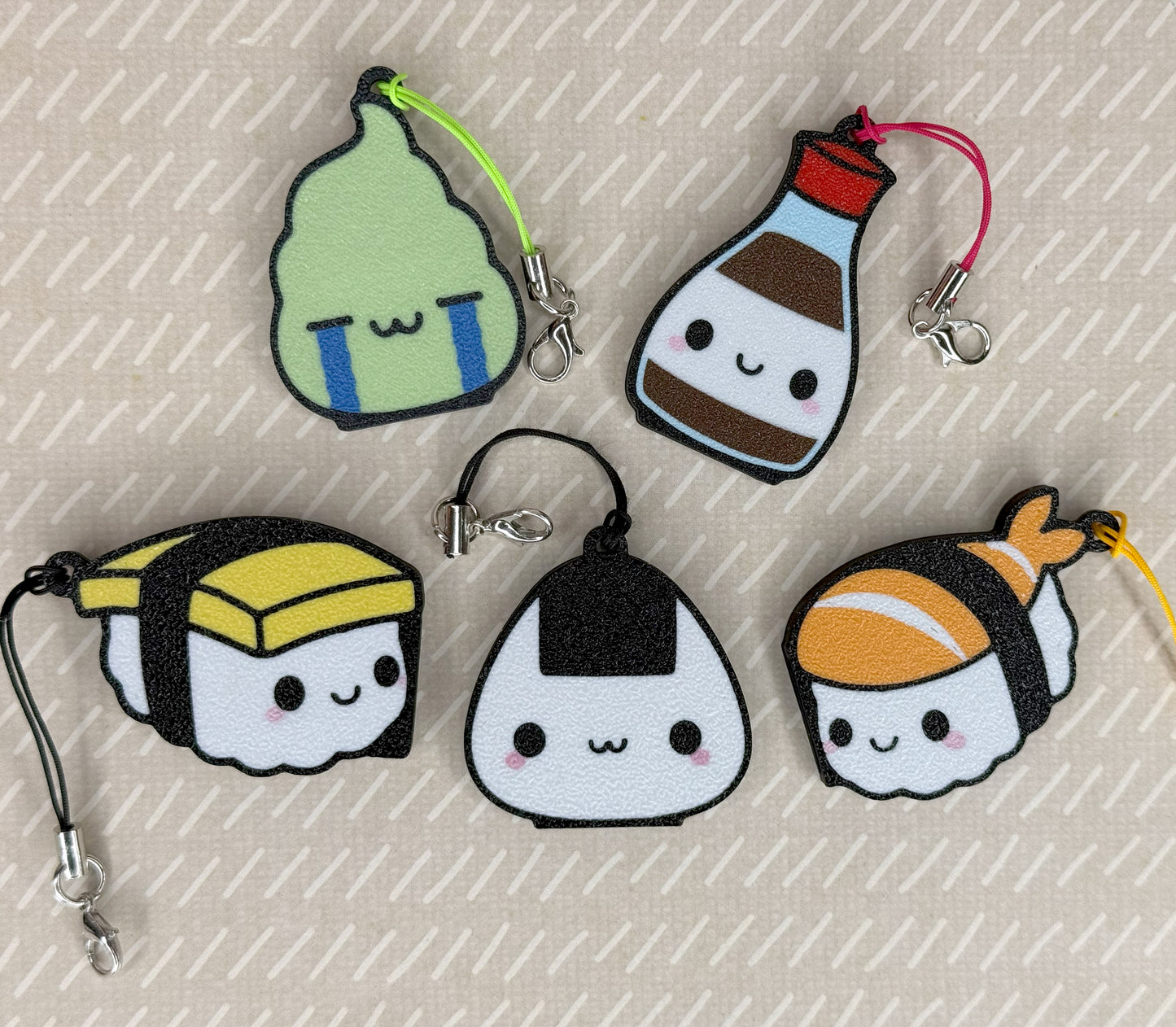 Set of cute Tab Buddies shaped like food items on a textured surface