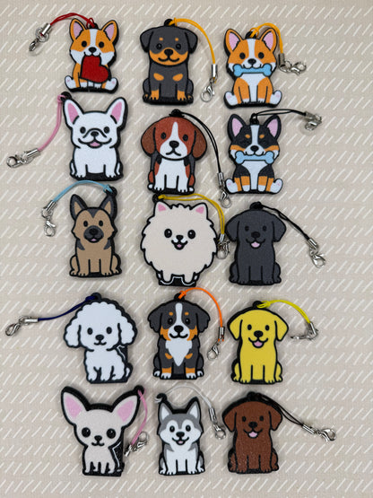 A collection of 15 different dog-themed soda Tab Buddy designs rests atop a beige background.