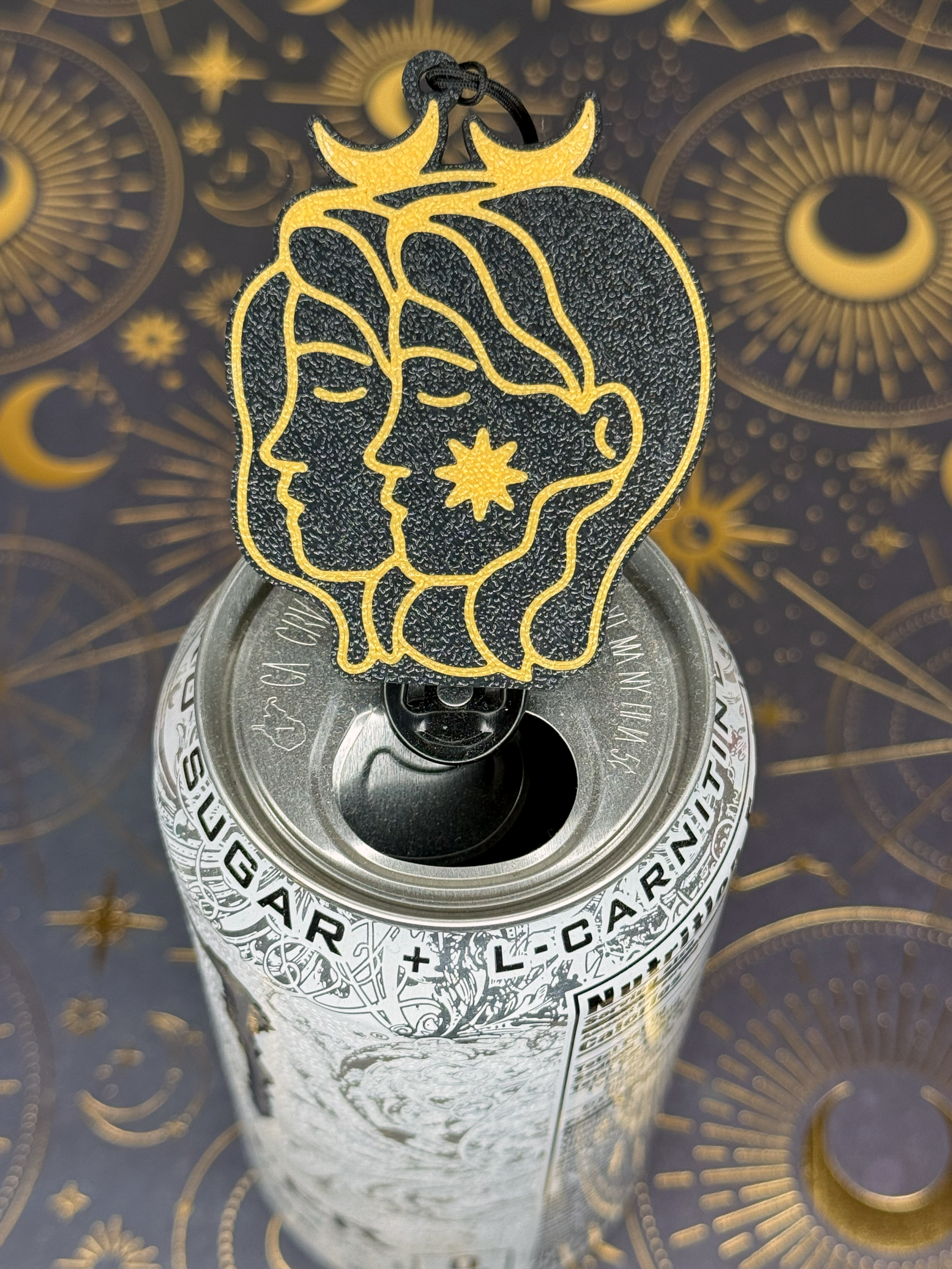 Decorative Gemini Zodiac Tab Buddy with astrological design on a can against an ornate background