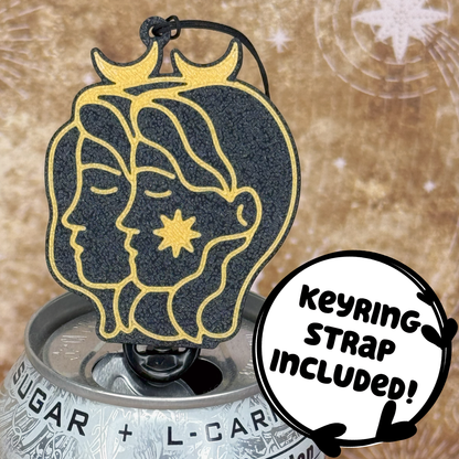 Gemini design Zodiac Tab Buddy sits atop a can against a starry background