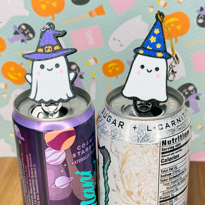 Two cans with Halloween-themed ghost  witch and ghost wizard Tab Buddies on a colorful background.
