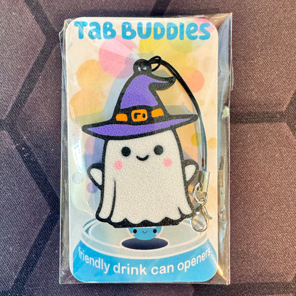 Packaged ghost witch Tab Buddy with keyring strap, labeled 'Tab Buddies' on a textured surface.