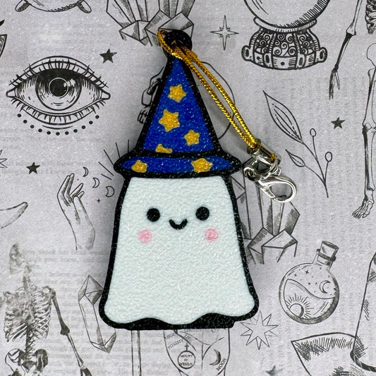 A ghost wizard Tab Buddy with a blue wizard hat on a patterned background
