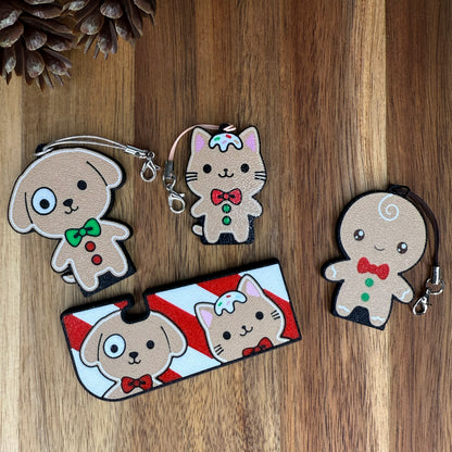Set of cute animal-themed gingerbread Tab Buddies and Tab Buddy XL on a wooden surface.