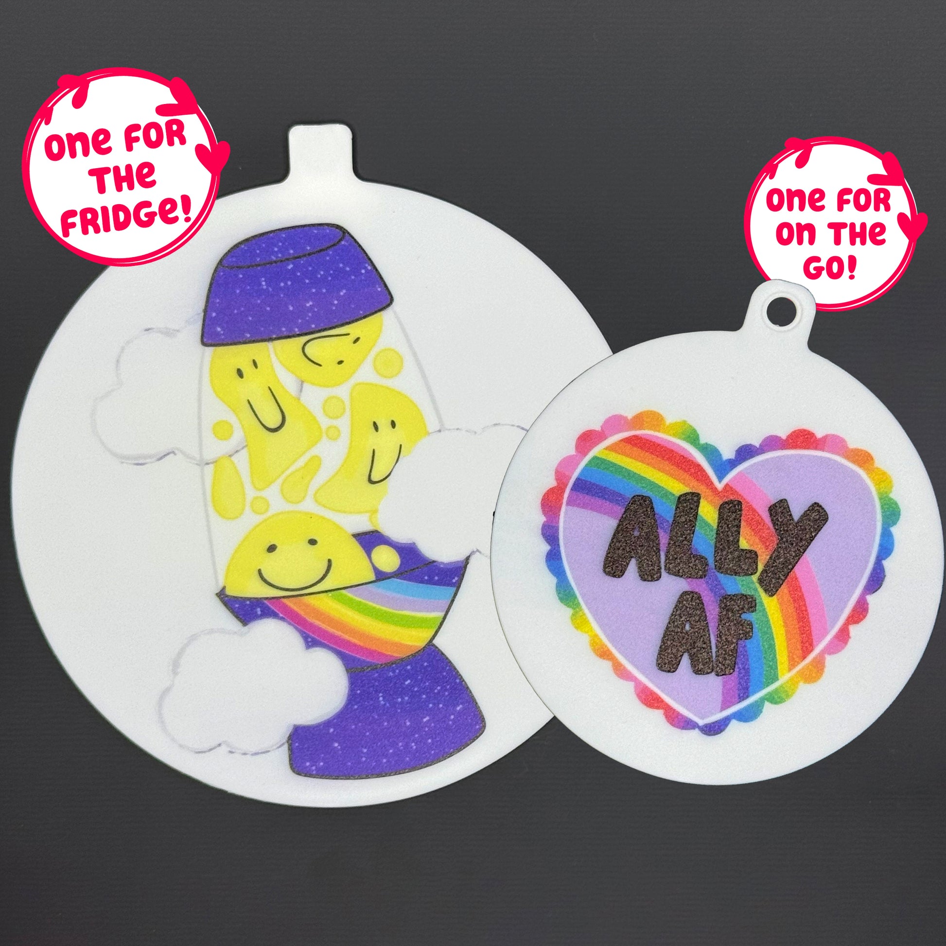 Two circular Groovy Pride-themed Grippy pads are shown against a grey background. Text bubbles read, "One for the fridge," and "One for on the go!"