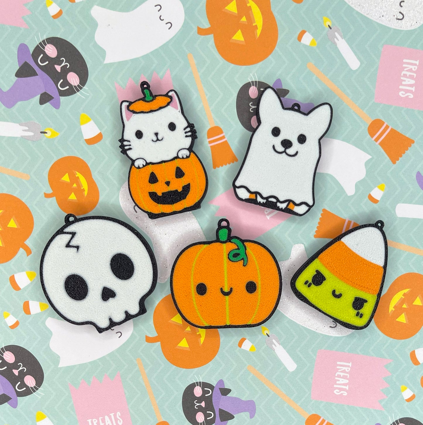 Set of 5 Halloween-themed Tab Buddies with pumpkins, ghosts, and cats on a light blue background.