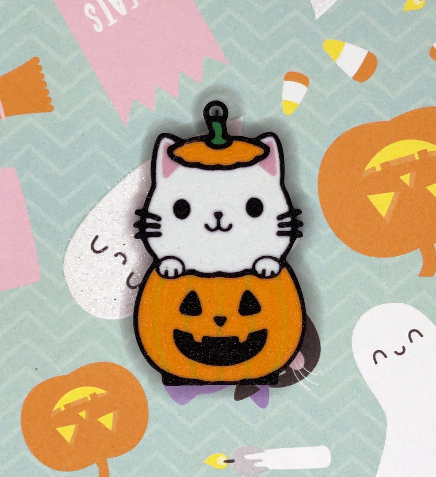 Cute cat in a pumpkin Tab Buddy with Halloween-themed background