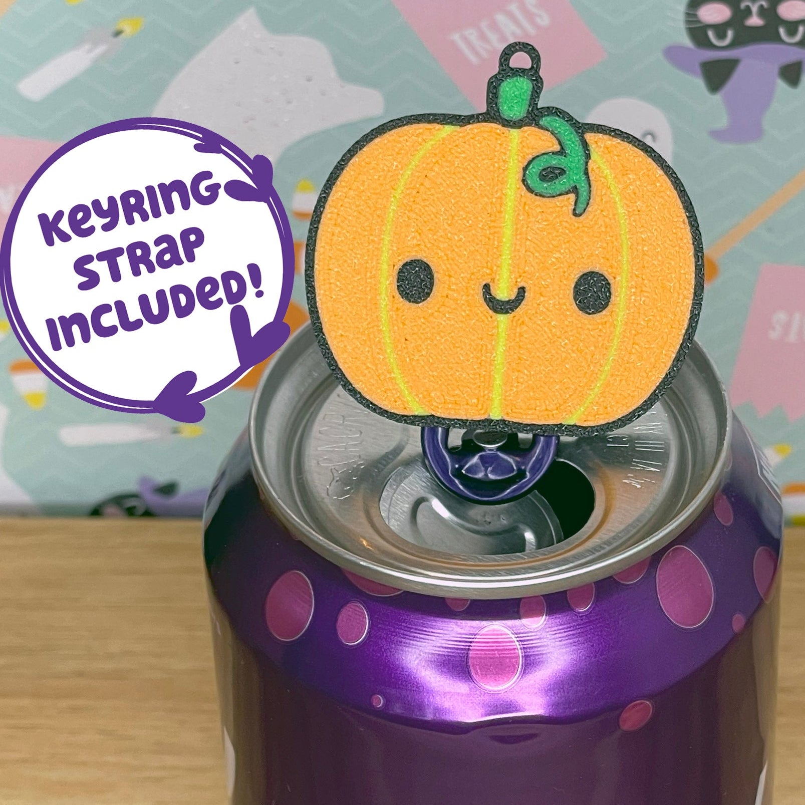 Bubly sparkling water can with a Halloween-themed Tab Buddy on a wooden surface.