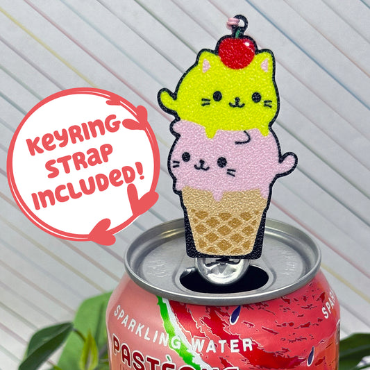 Pink and yellow Kitty Cone Tab Buddy with Keychain strap rests atop a can of sparkling water.