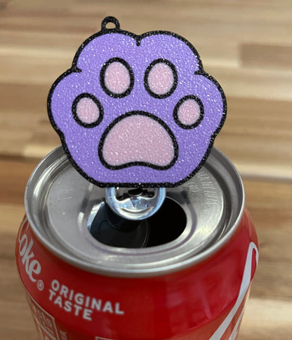 Purple paw-shaped Tab Buddy on a Coca-Cola can
