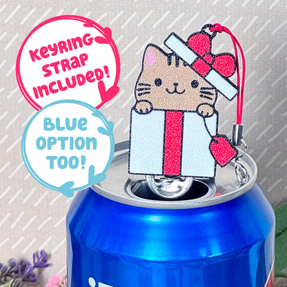 Keychain with a beige cat Tab Buddy on top of a blue can, with text indicating keyring strap included.