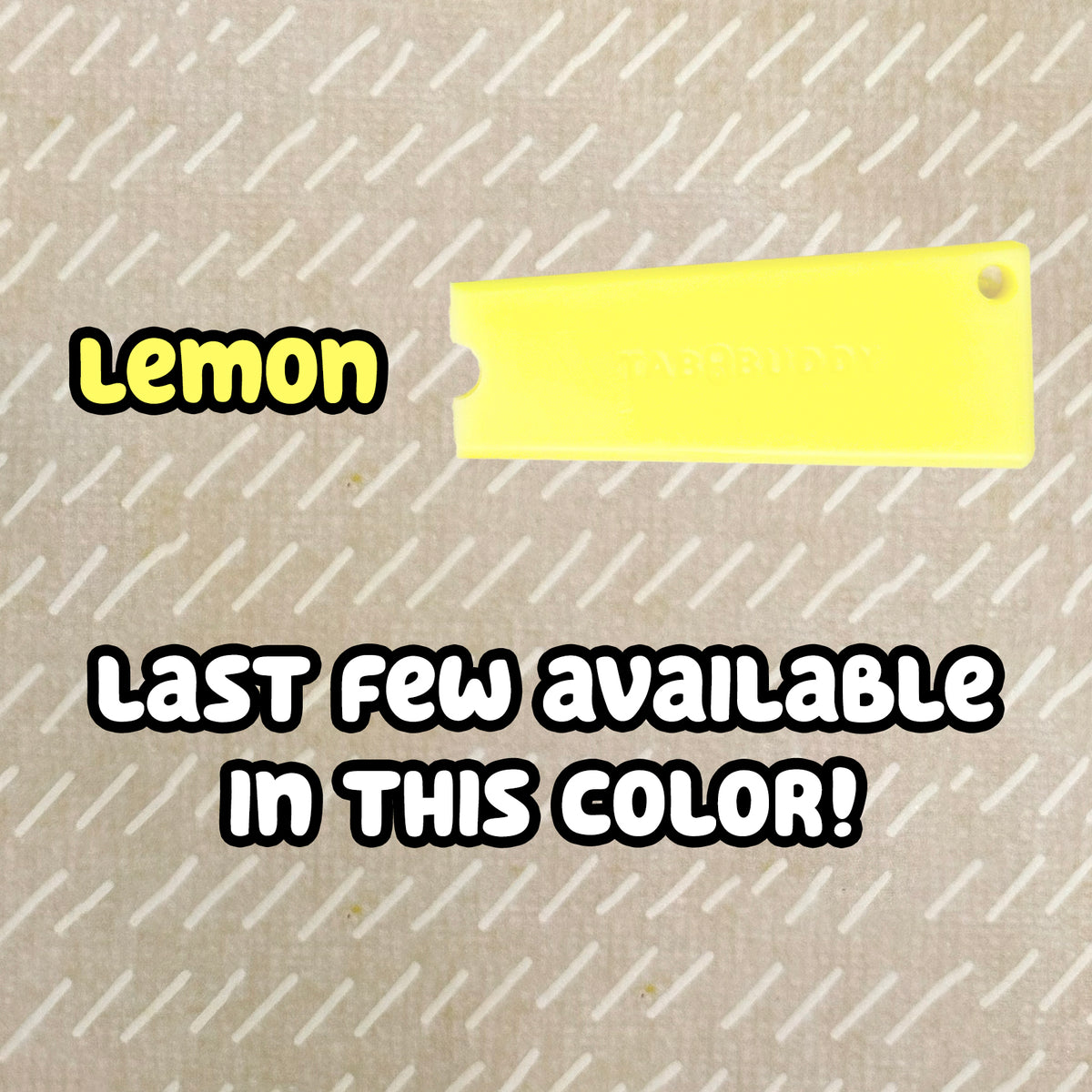 A lemon-yellow Tab Buddy Classic rests on a beige surface with text labeling the color option as "lemon." A note below reads "last few available in this color!"