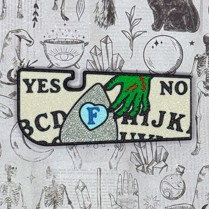 Magical decision-making Ouija Tab Buddy XL with 'Yes', 'No', and alphabet choices on a mystical background.
