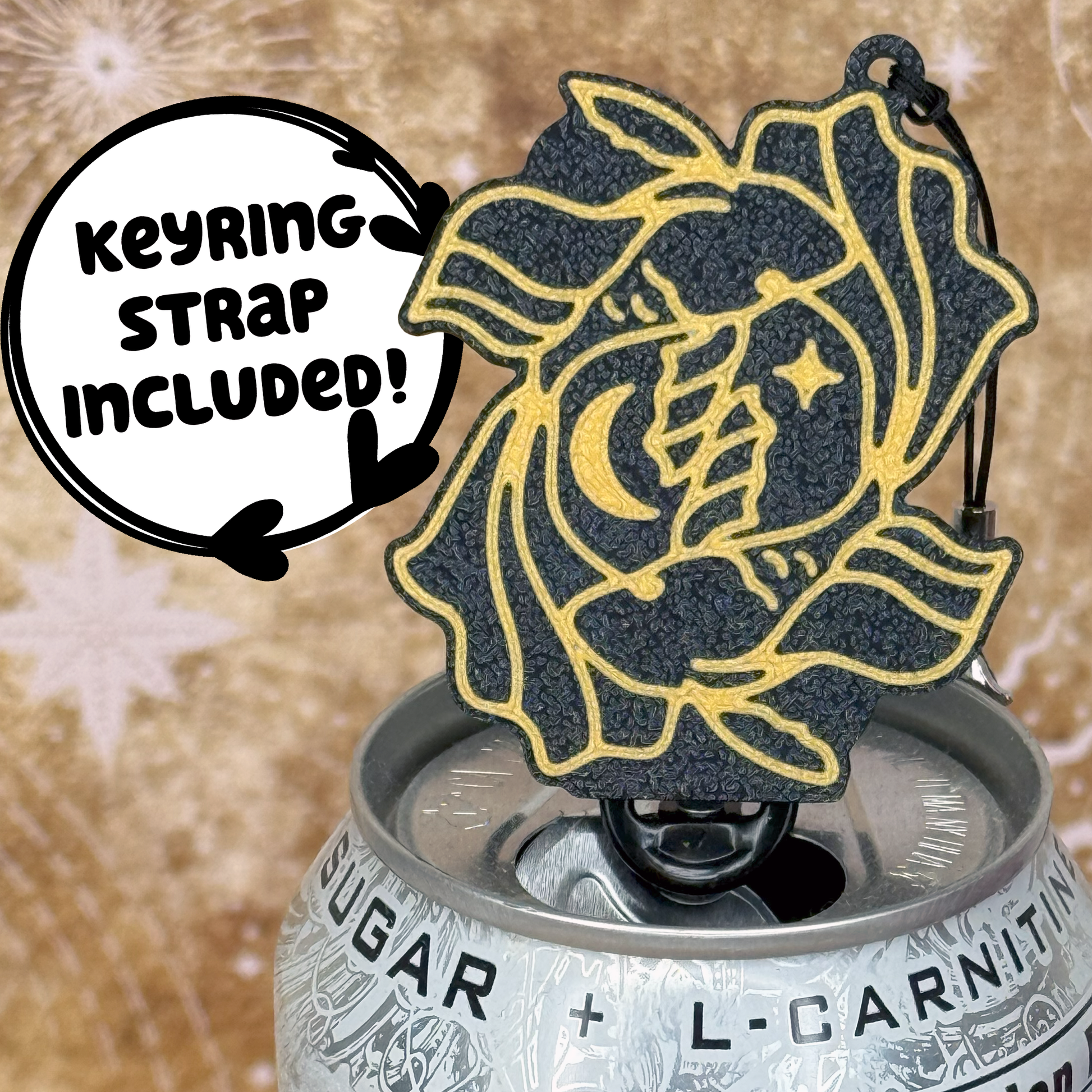 Pisces design Tab Buddy with Keyring strap sits atop a can with decorative starry background 