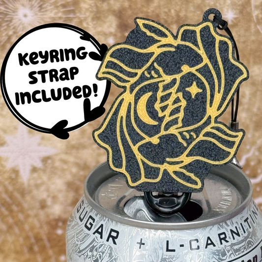 Pisces design Tab Buddy with Keyring strap sits atop a can with decorative starry background 