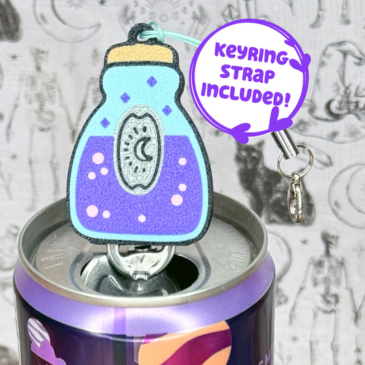 Potion bottle Tab Buddy keychain rests atop a can, text states "keyring strap included"