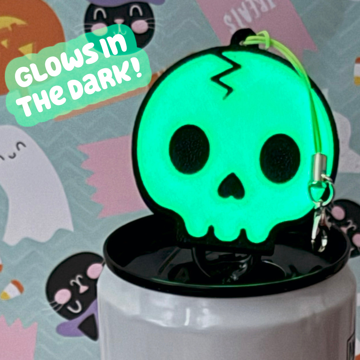 Glowing green skull-shaped Tab Buddy with 'Glow in the Dark!' text on a Halloween-themed background.
