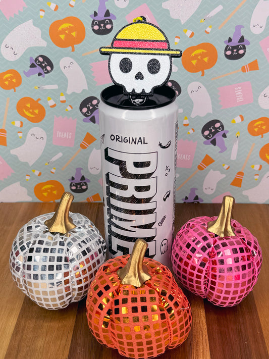 Energy drink can with a skull wearing a straw hat design on a colorful Halloween-themed background