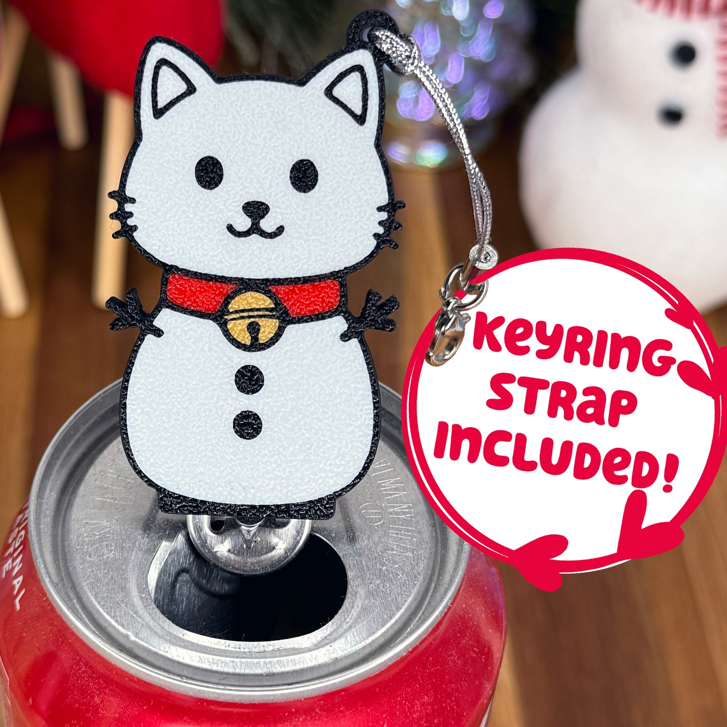 White cat Tab Buddy with a red strap on a can, with a 'Keyring Strap Included!' label.