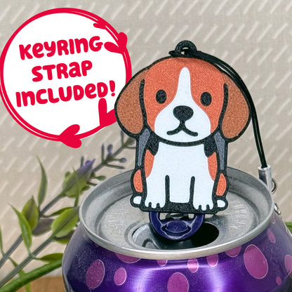 A cute Beagle design Tab Buddy rests atop an open can of sparkling water. Text bubble reads, "Keyring Strap Included!"