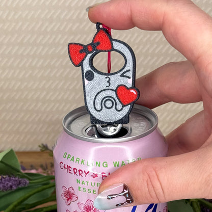 Tab Buddy with cartoon design of a winking tab blowing a heart on a can of sparkling water