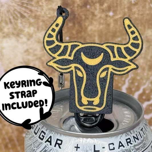 Tab Buddy keychain with Taurus Zodiac  bull design sits atop an energy drink can, featuring a keyring strap included label.