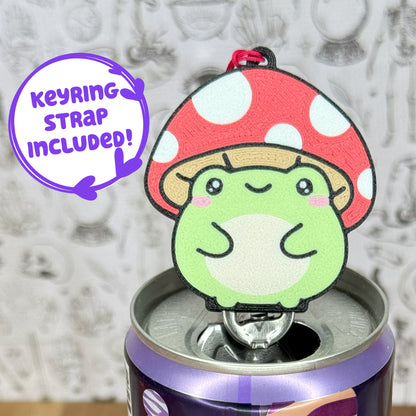 Tab Buddy of a toadstool frog on top of a can, against a textured gray background with text that reads 'keyring strap included'.