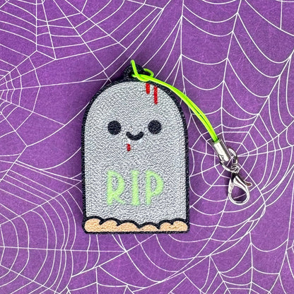 Ghostly tombstone Tab Buddy with 'RIP' on a spider web background