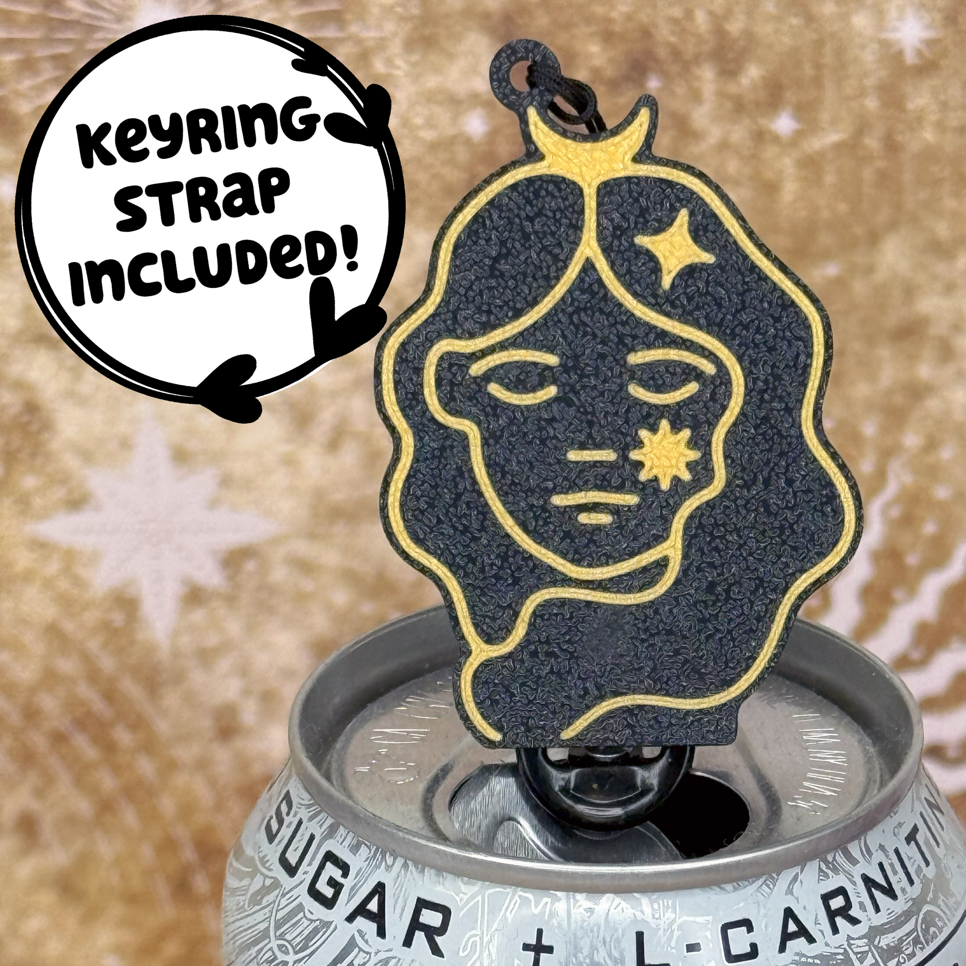 Virgo themed black and gold Tab Buddy  with astrological design sits atop a can against a starry background