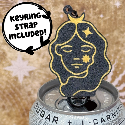 Virgo themed black and gold Tab Buddy  with astrological design sits atop a can against a starry background