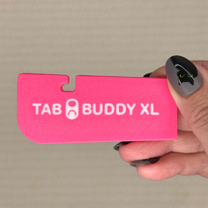Bright Pink 'Tab Buddy XL' product held by a hand against a beige background