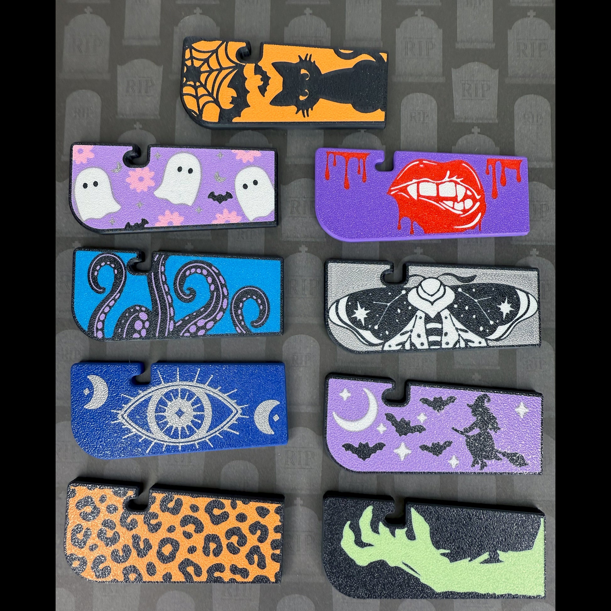 Collection of Halloween-themed Tab Buddy XLs on a matching patterned background