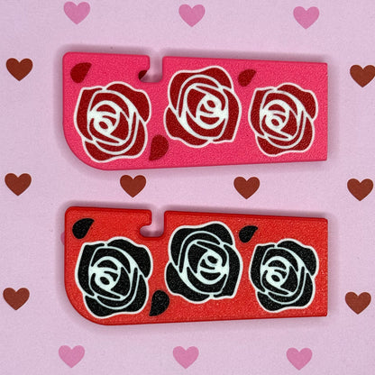 TwoTab Buddy XLs with rose designs on a pink background with hearts.