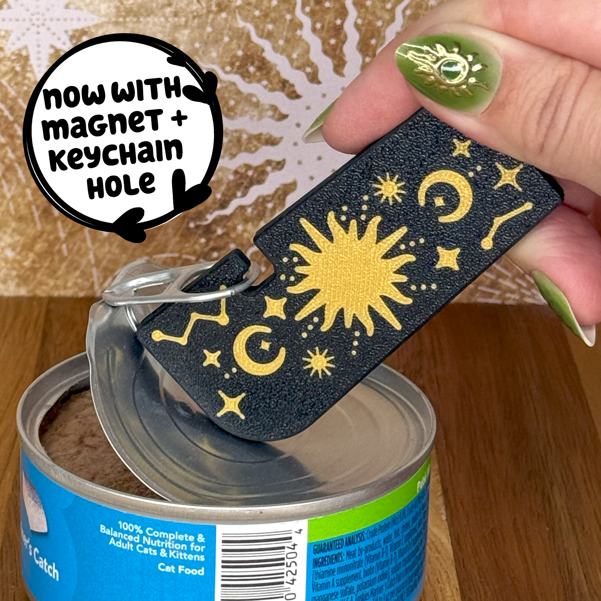 Tab Buddy XL Can opener with celestial design being used on a can of cat food.